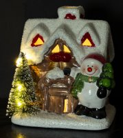 Hiša s snežakom in LED osvetlitvijo